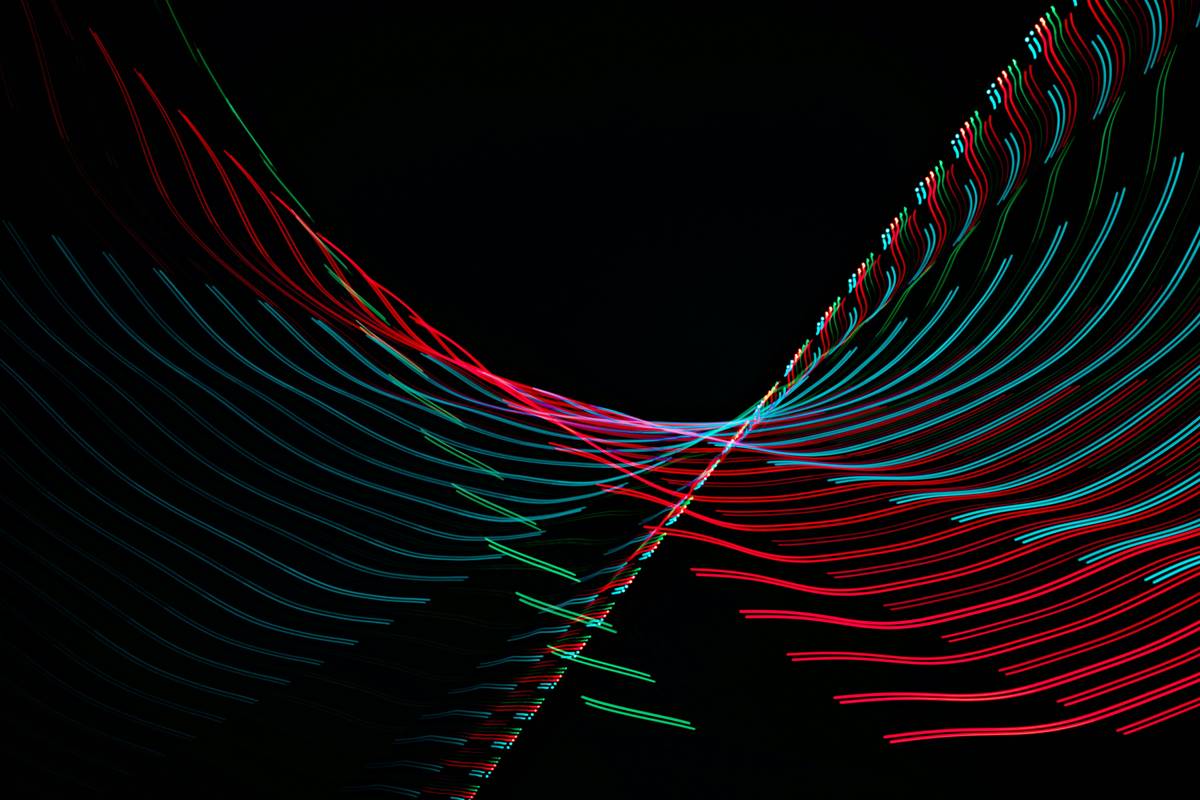 Developer testing motion graphic interactive art with dual-motion controllers in VR studio